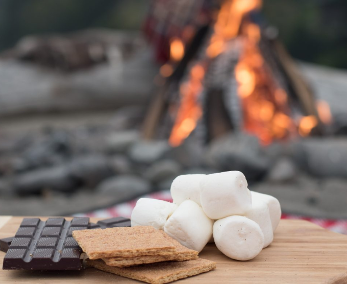 Marshmallows roasting near a campfire.